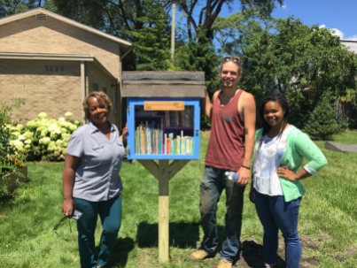 Clinical Nurse Manager (and Little Library Steward!) Alisa Smith and the library builders, Erik Krieger and Maya Faison.