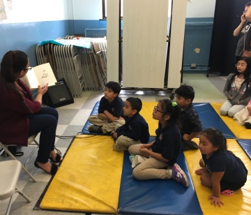 Ana Barajas reads for the El día de los niños/El día de los libros at César Chávez Elementary School